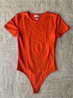 Aritzia Babaton Contour Short Sleeve Bodysuit in Orange